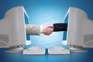 Computers shaking hands